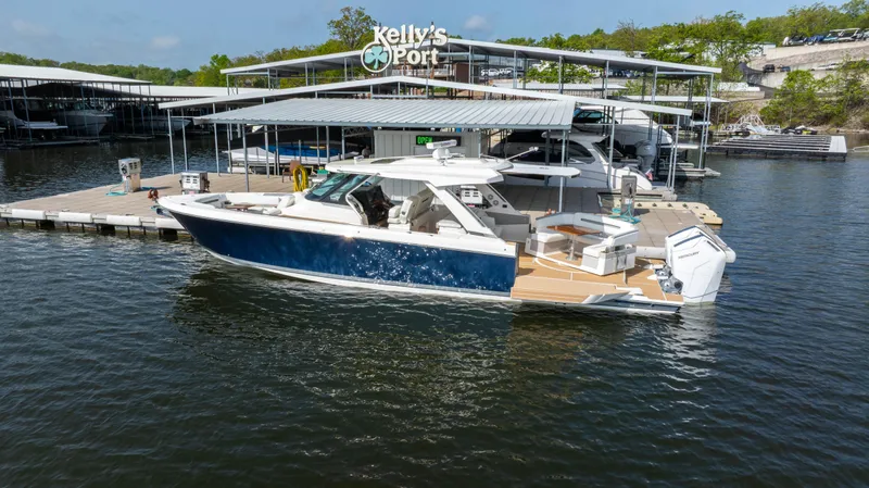 Slide: The Image of 2024 Tiara Yachts 43 LS docked at Kelly's Port marina. - 15
