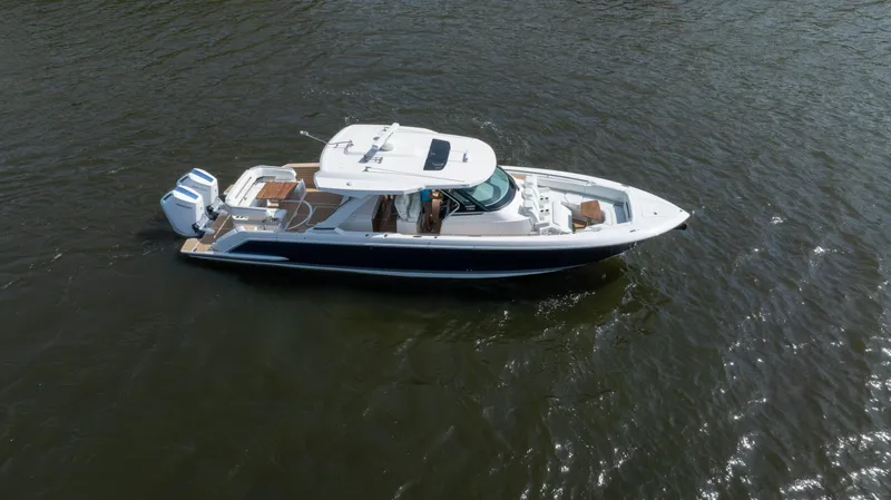 Slide: The Image of 2024 Tiara Yachts 43 LS cruising on open water, showcasing sleek design and luxury features. - 20