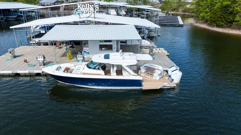 Slide: The Image of 2024 Tiara Yachts 43 LS docked at Kelly's Port marina. - 3