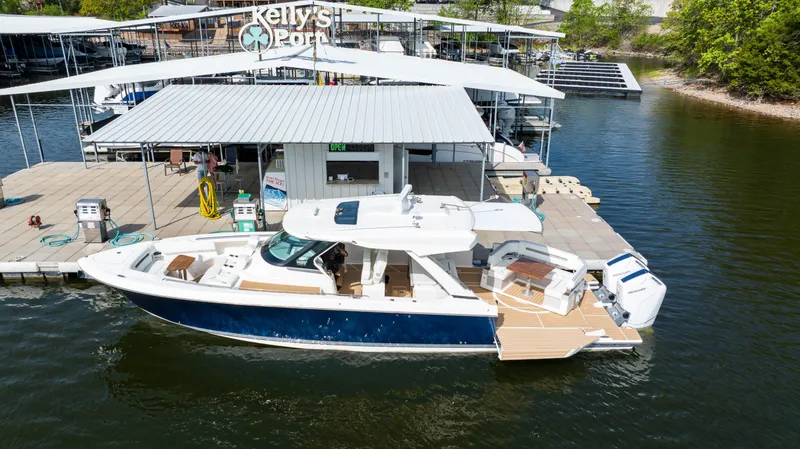 Slide: The Image of 2024 Tiara Yachts 43 LS docked at Kelly's Port marina. - 4
