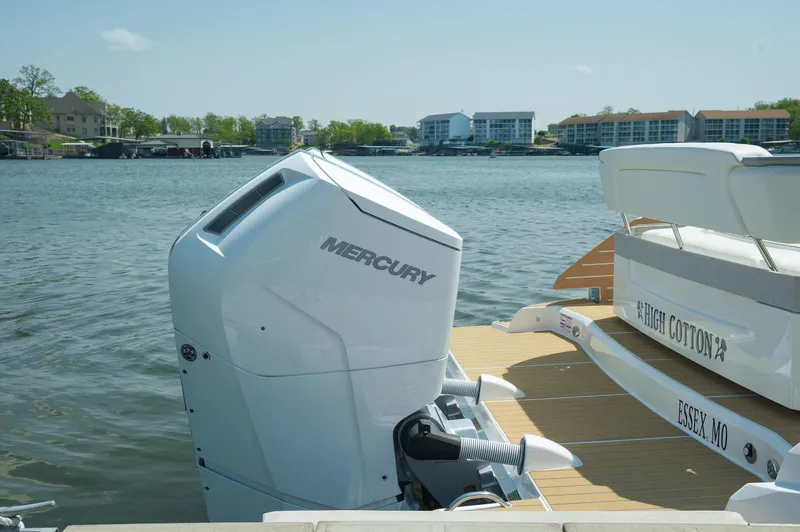 Slide: The Image of 2024 Tiara Yachts 43 LS with Mercury outboard engine docked by the water. - 41
