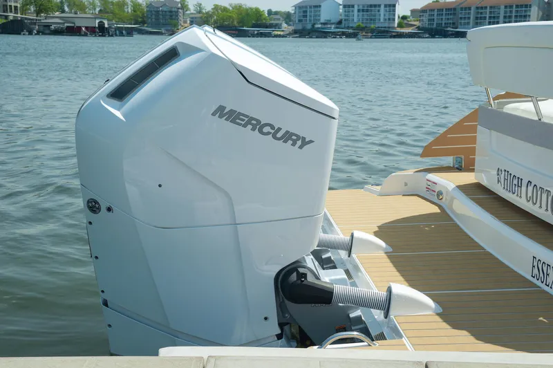 Slide: The Image of 2024 Tiara Yachts 43 LS with Mercury outboard engine on a sunny waterfront. - 42