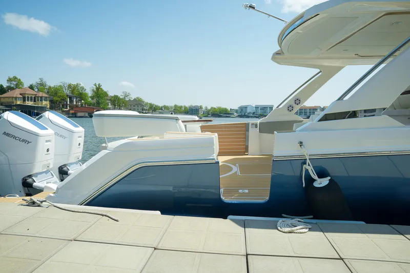 Slide: The Image of 2024 Tiara Yachts 43 LS docked, showcasing sleek design and powerful Mercury engines. - 44