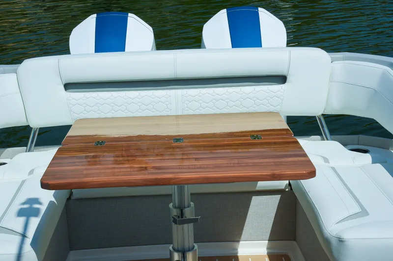 Slide: The Image of 2024 Tiara Yachts 43 LS interior with elegant wooden table and white seating. - 45