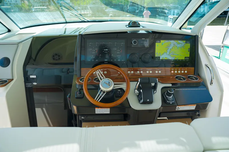 Slide: The Image of 2024 Tiara Yachts 43 LS helm with advanced navigation and control systems. - 47