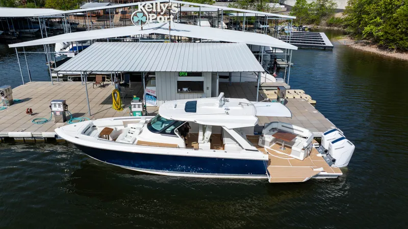 Slide: The Image of 2024 Tiara Yachts 43 LS docked at Kelly's Port marina. - 5