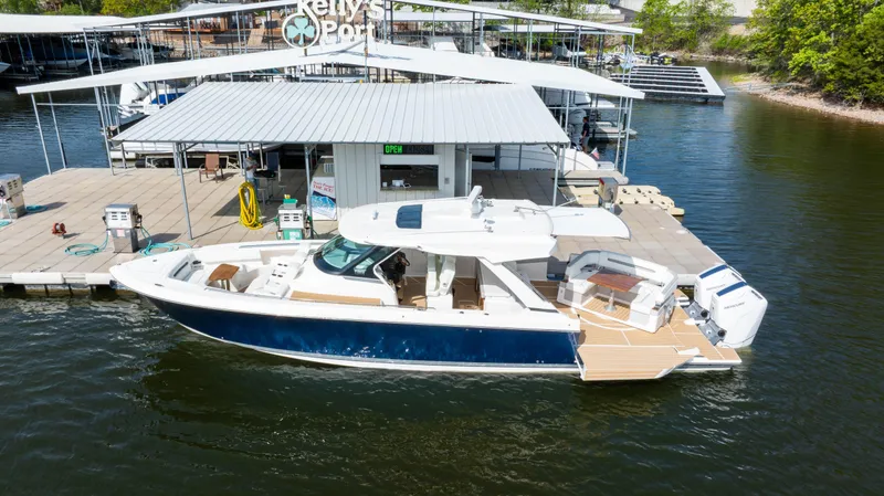 Slide: The Image of 2024 Tiara Yachts 43 LS docked at marina, showcasing sleek design and luxury features. - 6