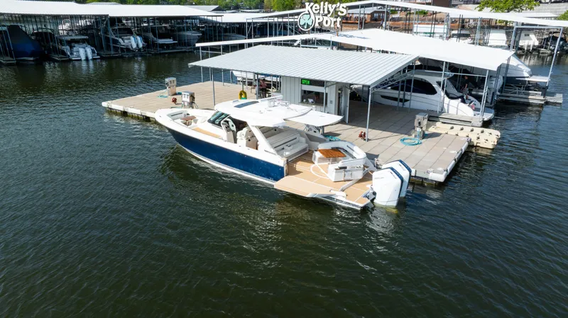 Slide: The Image of 2024 Tiara Yachts 43 LS docked at Kelly's Port marina. - 8