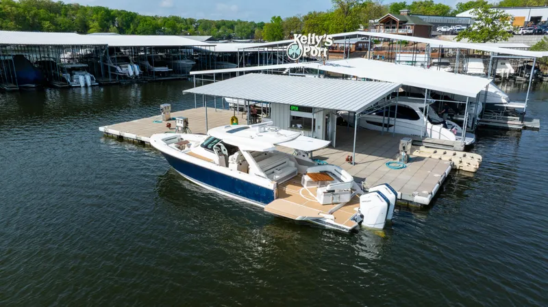 Slide: The Image of 2024 Tiara Yachts 43 LS docked at Kelly's Port marina. - 9