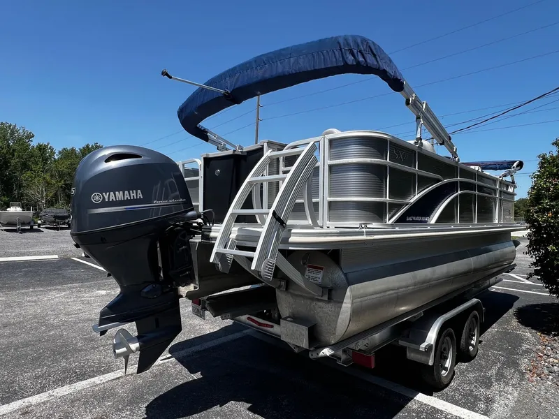 Slide: The Image of 2021 Bennington SX 21 SFXAPG pontoon boat with Yamaha outboard motor on trailer. - 6