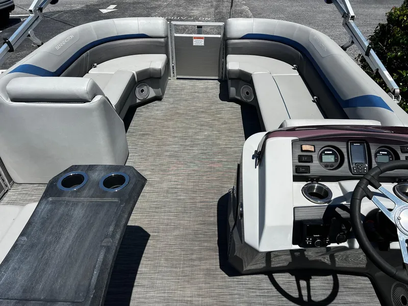 Slide: The Image of 2021 Bennington SX 21 SFXAPG pontoon boat interior with seating and control panel. - 8
