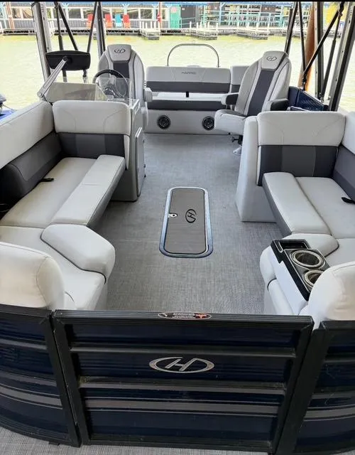 Slide: The Image of 2022 Harris Cruiser 230 pontoon boat interior with spacious seating and modern design. - 10