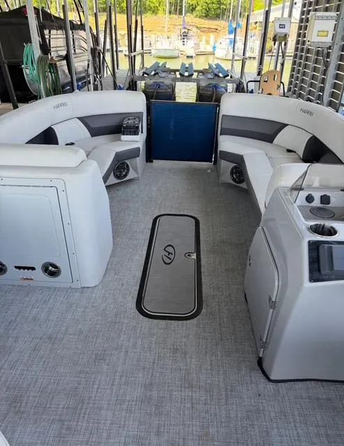 Slide: The Image of 2022 Harris Cruiser 230 interior with spacious seating and modern amenities. - 16