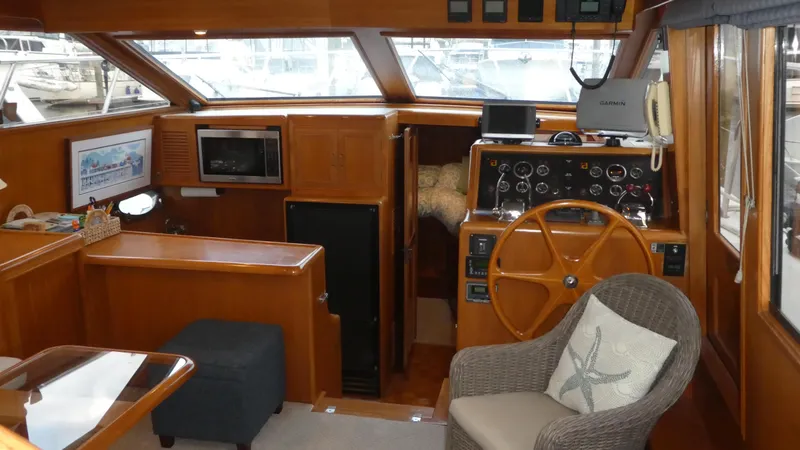 Slide: The Image of 1993 Ocean Alexander 440 Sundeck CPMY interior with helm, seating, and wooden finishes. - 13