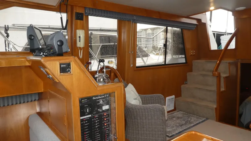 Slide: The Image of Interior of 1993 Ocean Alexander 440 Sundeck CPMY with helm, seating, and stairs. - 14
