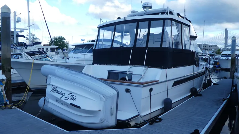 Slide: The Image of 1993 Ocean Alexander 440 Sundeck CPMY docked at marina, rear view. - 2