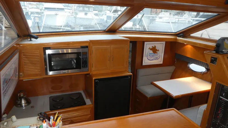 Slide: The Image of Interior of 1993 Ocean Alexander 440 Sundeck CPMY with kitchen and dining area. - 20