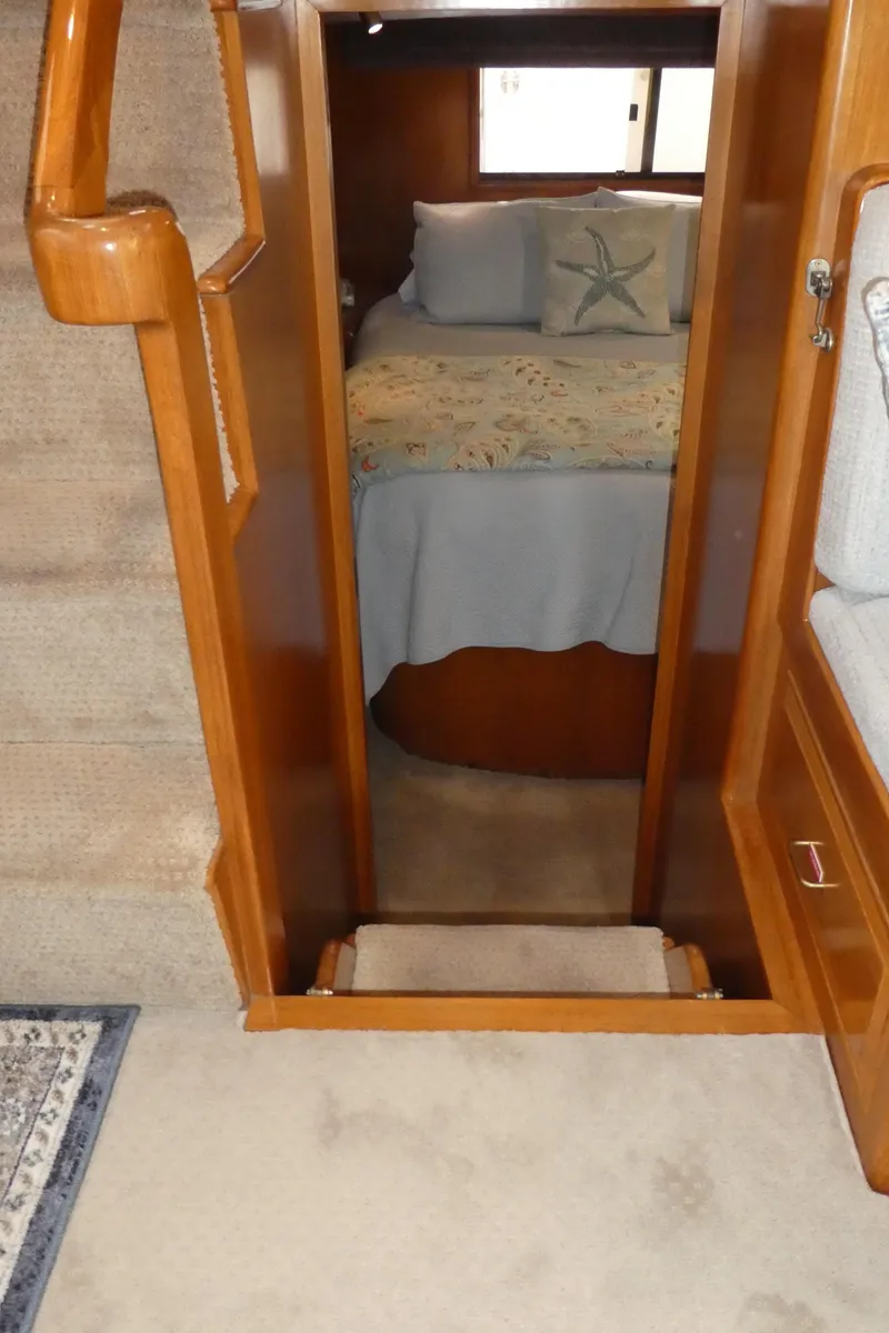 Slide: The Image of 1993 Ocean Alexander 440 Sundeck CPMY interior cabin with bed and wooden furnishings. - 28