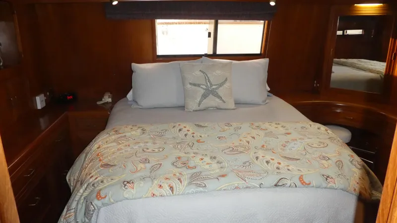 Slide: The Image of Cozy bedroom in 1993 Ocean Alexander 440 Sundeck CPMY with nautical-themed bedding. - 29