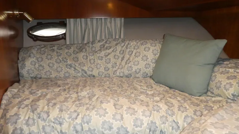 Slide: The Image of Cozy cabin bed in 1993 Ocean Alexander 440 Sundeck CPMY with floral bedding. - 40