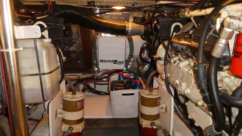 Slide: The Image of Engine room of 1993 Ocean Alexander 440 Sundeck CPMY, showcasing machinery and components. - 47