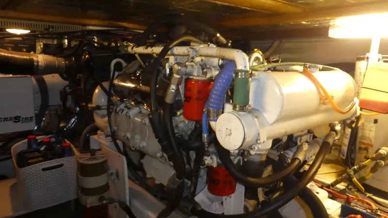 Slide: The Image of Engine room of 1993 Ocean Alexander 440 Sundeck CPMY yacht, showcasing mechanical components. - 48