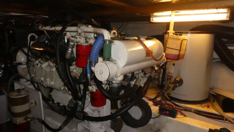 Slide: The Image of Engine room of 1993 Ocean Alexander 440 Sundeck CPMY with visible machinery and components. - 49