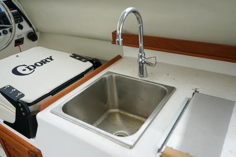 Slide: The Image of C-Dory 25' Cruiser 2021 boat interior with sink and faucet. - 15