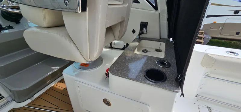 Slide: The Image of 2016 Boston Whaler 285 Conquest interior with seating and countertop details. - 20