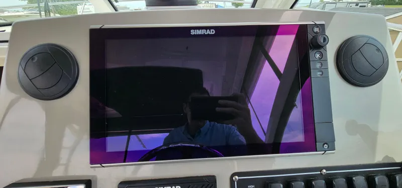Slide: The Image of Control panel of 2016 Boston Whaler 285 Conquest with Simrad display. - 27