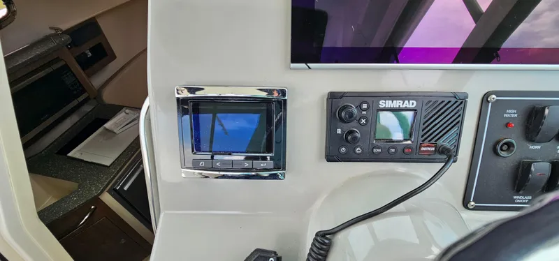Slide: The Image of Control panel of a 2016 Boston Whaler 285 Conquest boat with navigation equipment. - 28