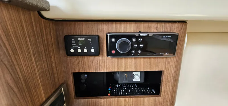 Slide: The Image of Control panel of a 2016 Boston Whaler 285 Conquest boat with audio system. - 44