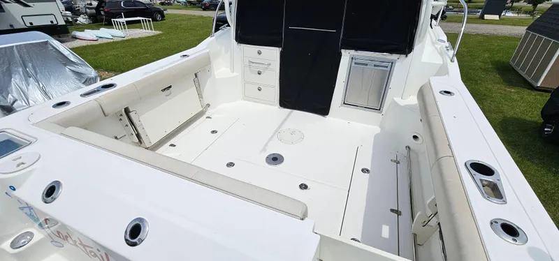 Slide: The Image of 2016 Boston Whaler 285 Conquest boat deck with seating and storage compartments. - 7