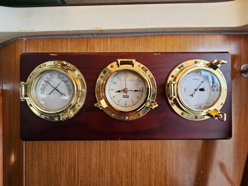 Slide: The Image of Brass nautical instruments on a Beneteau 323 yacht, model year 2008. - 16