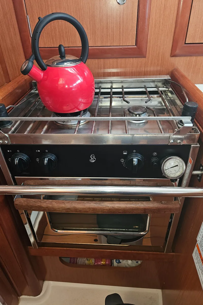 Slide: The Image of Red kettle on stove in 2008 Beneteau 323 yacht kitchen. - 17