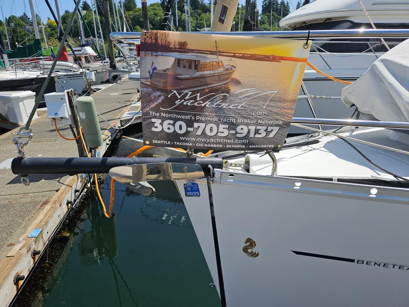 Slide: The Image of Beneteau 323 sailboat docked with yacht brokerage sign, 2008 model. - 3