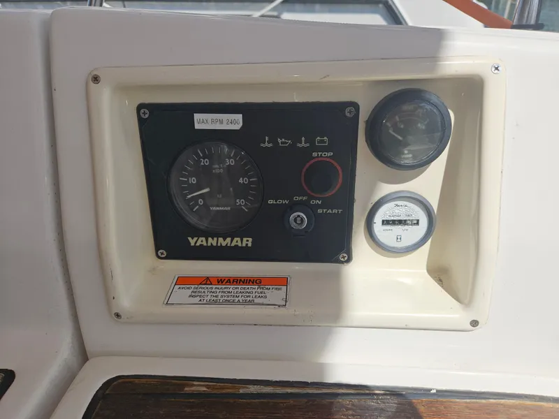 Slide: The Image of Control panel of a 2008 Beneteau 323 sailboat with Yanmar engine gauges. - 31