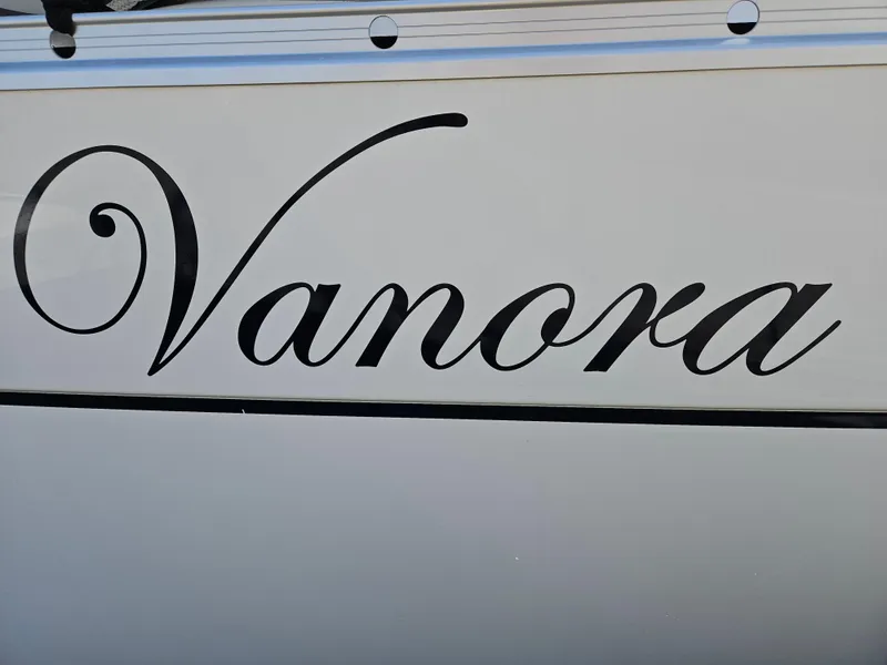 Slide: The Image of "Vanora" name on 2008 Beneteau 323 sailboat hull. - 4