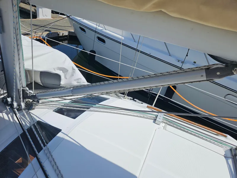 Slide: The Image of Sailboat deck view of a 2008 Beneteau 323, showing rigging and nearby boats. - 7