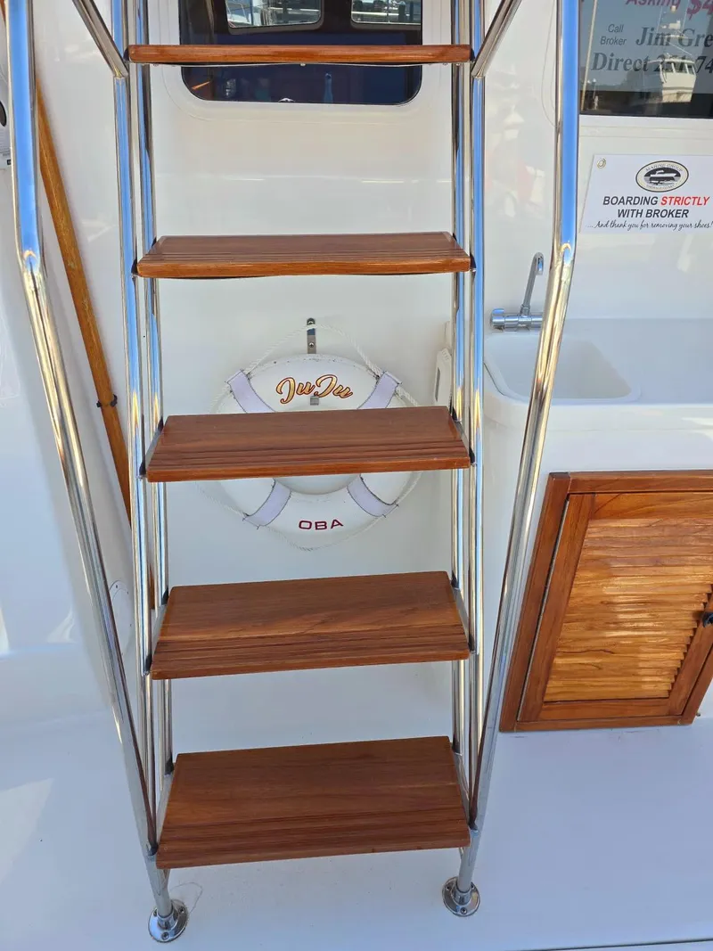Slide: The Image of Staircase on 2004 Sabreline 36 Flybridge Fast Trawler with wooden steps and safety ring. - 33