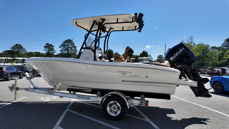 Slide: The Image of 2025 Pioneer 202 Islander boat on trailer, featuring Suzuki outboard motor, parked outdoors. - 15