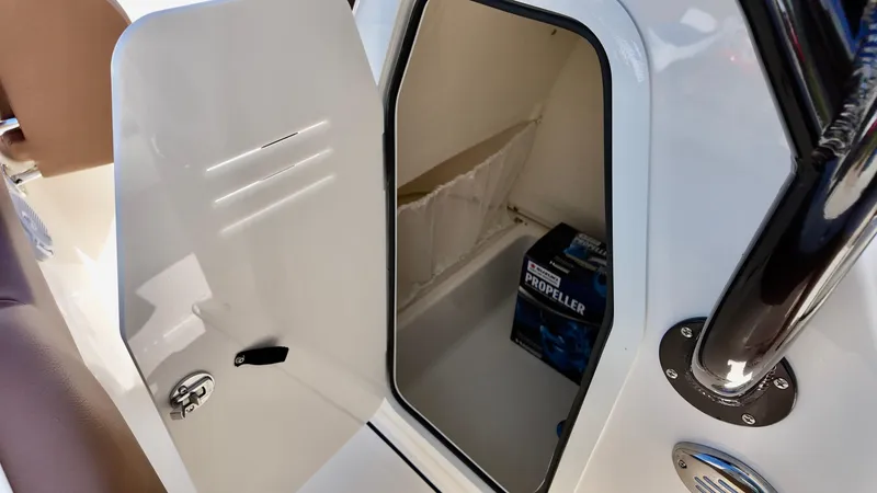 Slide: The Image of Open storage compartment in 2025 Pioneer 202 Islander boat with propeller box inside. - 3