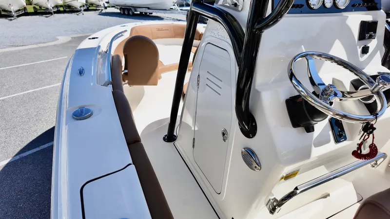 Slide: The Image of 2025 Pioneer 202 Islander boat interior with steering wheel and seating. - 4