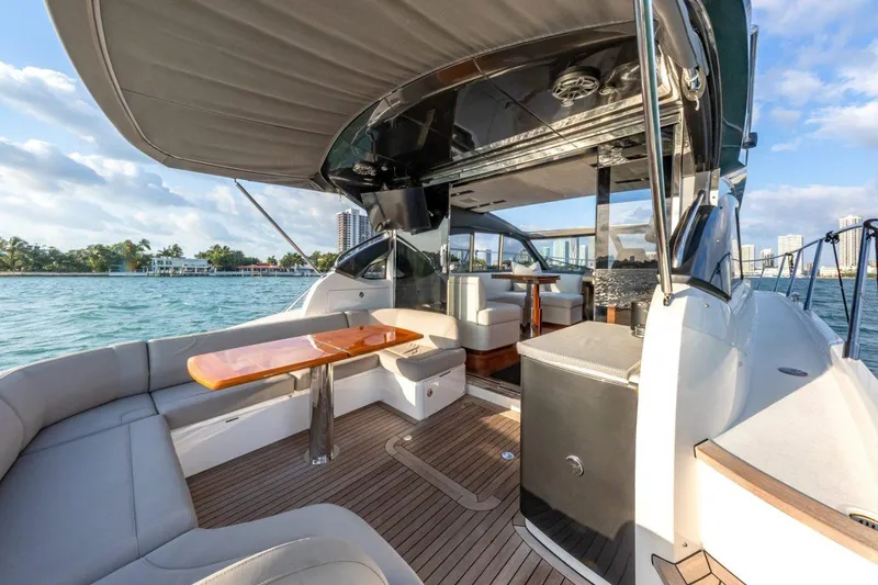 Slide: The Image of Luxurious 2017 Princess V48 Open yacht interior with elegant seating and wooden accents. - 10