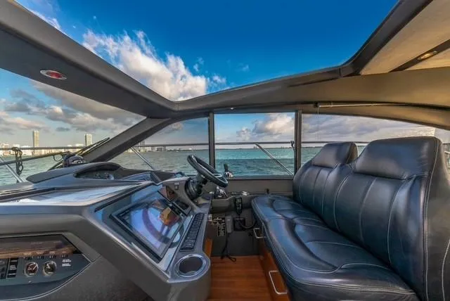 Slide: The Image of Interior of 2017 Princess V48 Open yacht with leather seating and ocean view. - 12