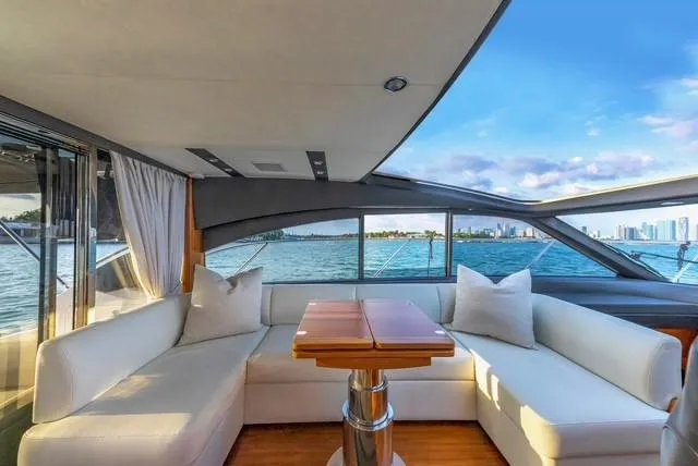Slide: The Image of Luxurious 2017 Princess V48 Open yacht interior with waterfront view and elegant seating. - 14