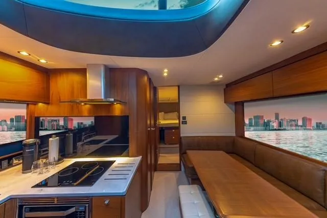 Slide: The Image of Luxurious interior of 2017 Princess V48 Open yacht with modern kitchen and seating area. - 23