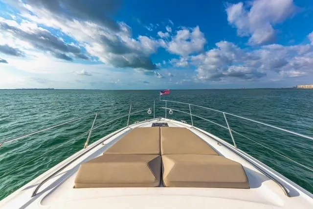 Slide: The Image of 2017 Princess V48 Open yacht cruising on open sea under blue sky. - 29