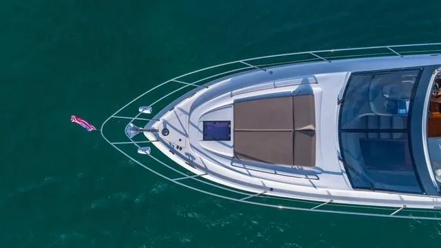 Slide: The Image of Aerial view of 2017 Princess V48 Open yacht on clear blue water. - 3