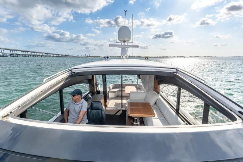 Slide: The Image of 2017 Princess V48 Open yacht cruising on a sunny day with bridge in background. - 5